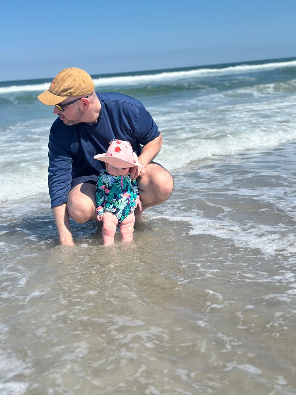 Michael Davis with his young daughter at the beach.